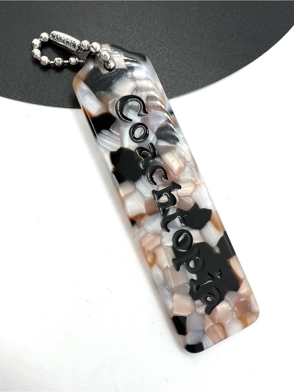 Coach Coachtopia Marbled Resin Hangtag Bag Charm Black Neutral Silver
Like New